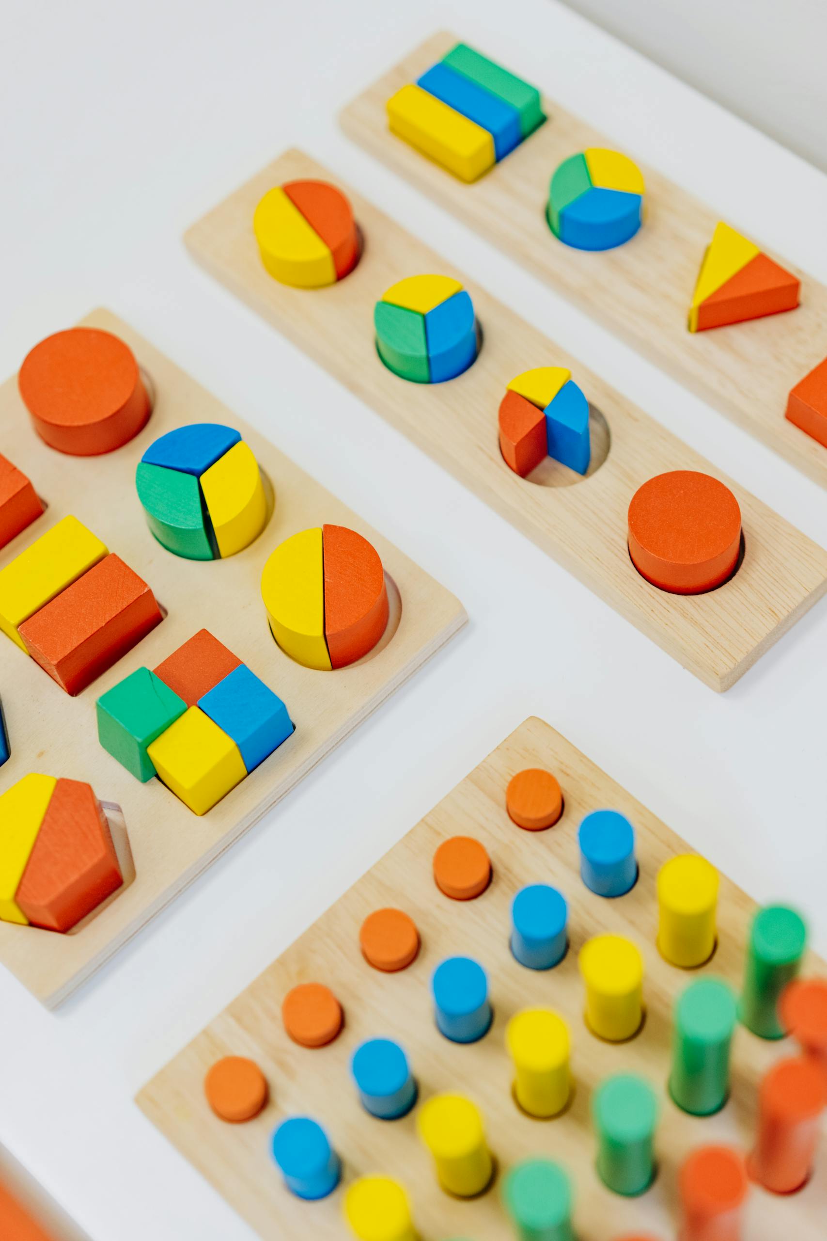 Close-up Shot of Colorful Shapes on the White Table